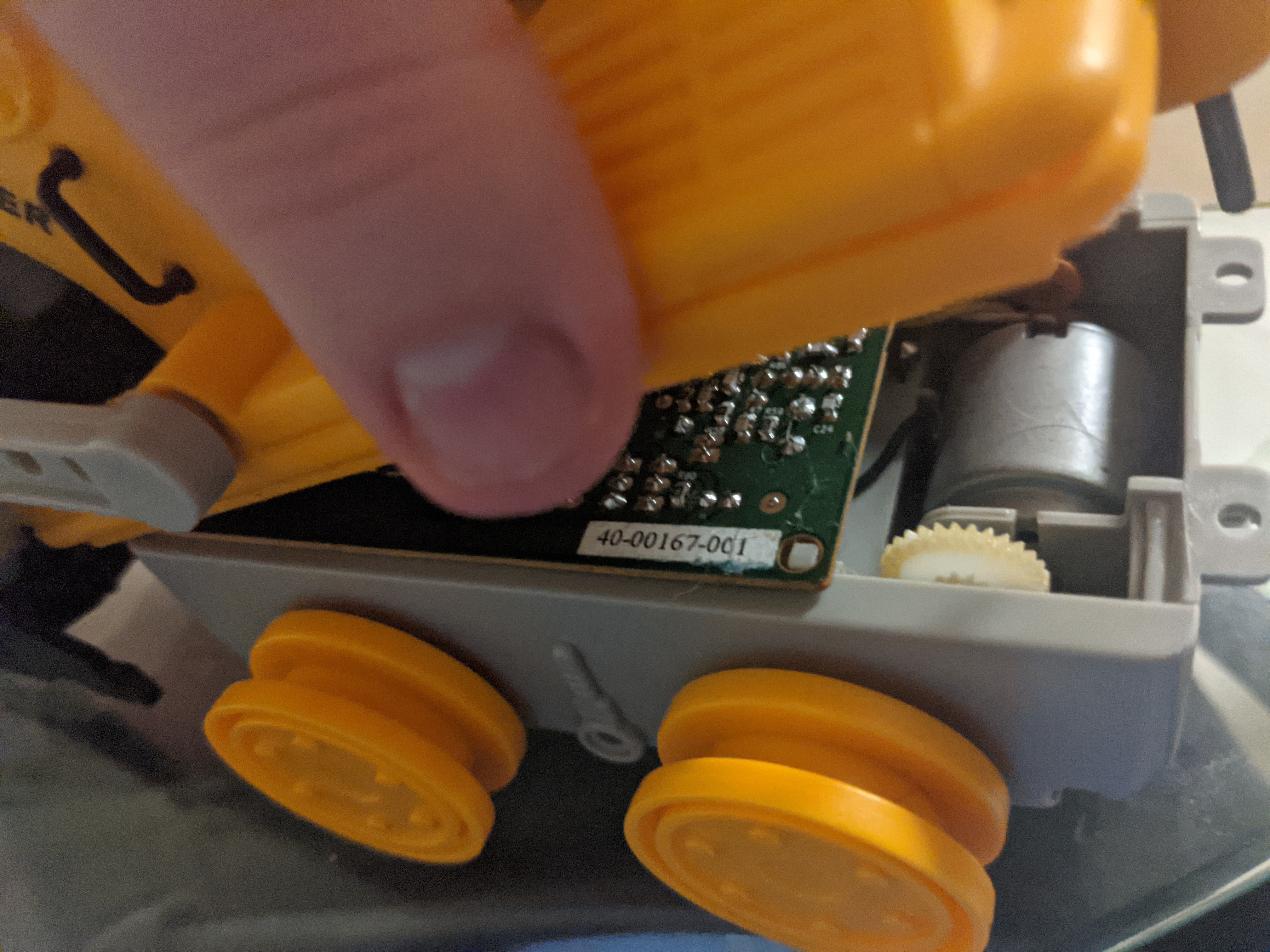 removing the two screws from the back underside of the vehicle